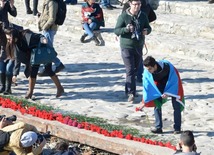 Baku residents bringing flowers to Seaside Boulevard to honor missing oil workers.  Azerbaijan, Dec.07, 2015